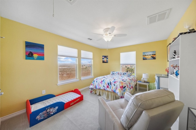 bedroom featuring visible vents, baseboards, a ceiling fan, and carpet flooring