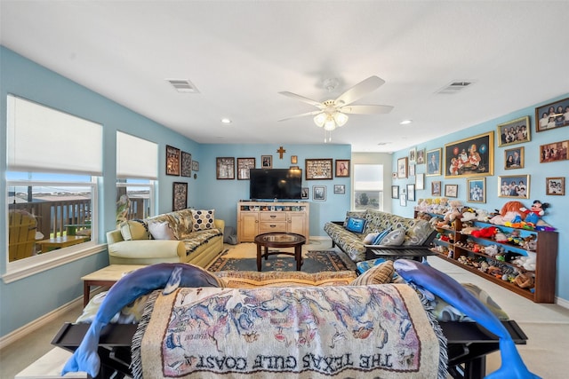 living room featuring visible vents, carpet floors, and baseboards