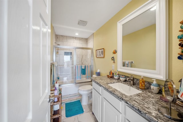 full bath featuring vanity, toilet, visible vents, and enclosed tub / shower combo