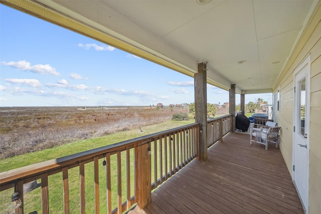 deck featuring grilling area and covered porch