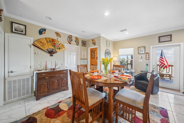 dining area featuring visible vents, marble finish floor, and ornamental molding