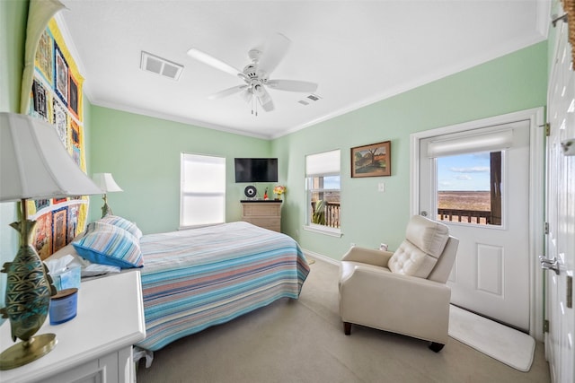 carpeted bedroom with crown molding, a ceiling fan, visible vents, and baseboards