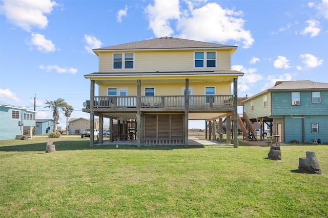 rear view of property with a carport, stairway, a lawn, and a patio area