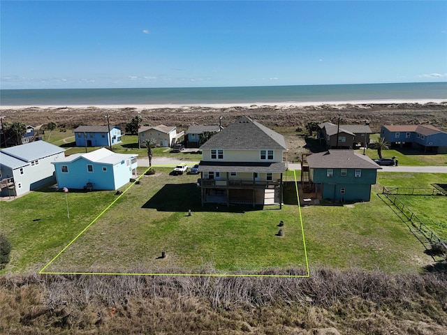 birds eye view of property with a residential view, a view of the beach, and a water view