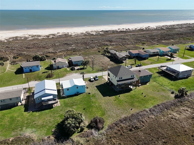 aerial view featuring a residential view, a beach view, and a water view