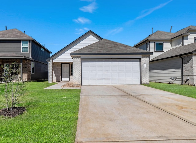 view of front of house with brick siding, driveway, an attached garage, and a front lawn