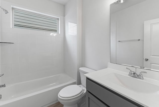 full bathroom featuring vanity, toilet, and shower / washtub combination