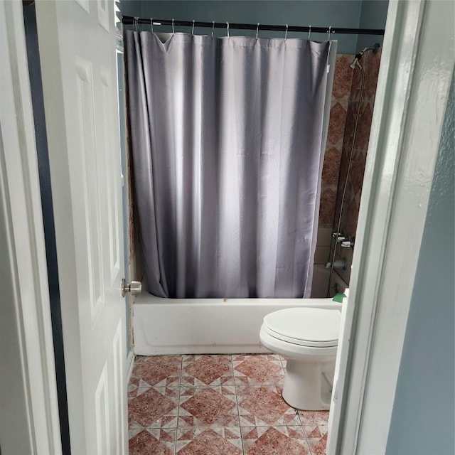 full bath with tile patterned floors, shower / bath combination with curtain, and toilet