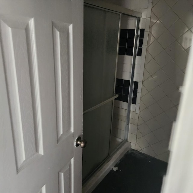 bathroom featuring a shower stall