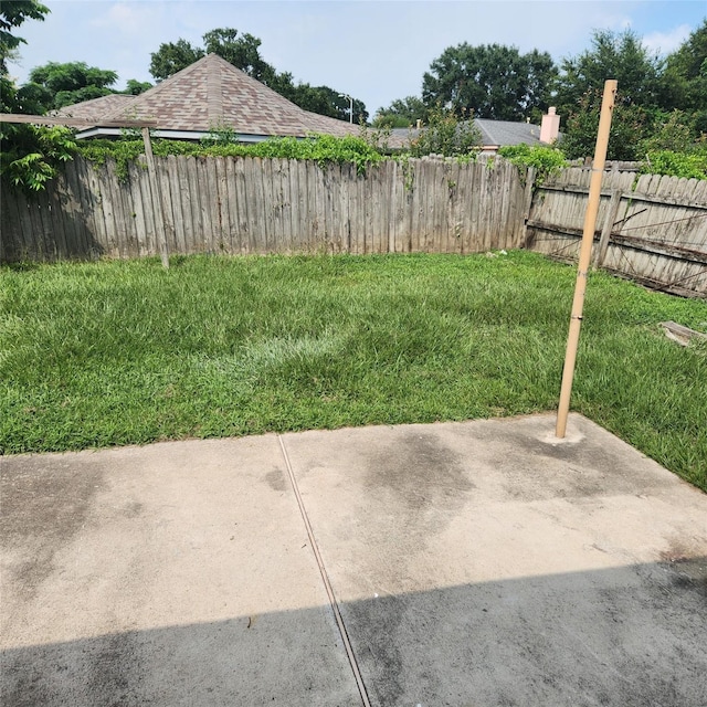 view of yard with a patio area and fence