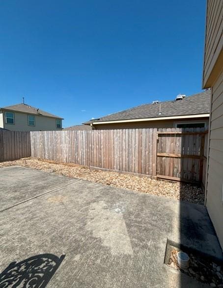 view of yard featuring a patio and fence