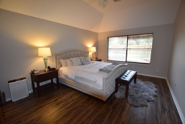 bedroom with lofted ceiling, wood finished floors, and baseboards