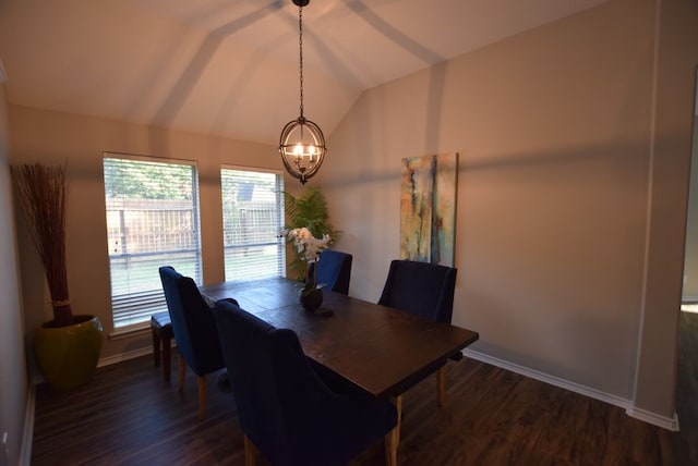 dining room featuring an inviting chandelier, baseboards, dark wood-type flooring, and lofted ceiling