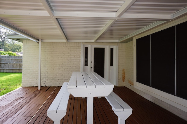 wooden terrace featuring fence