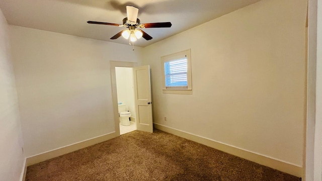 spare room featuring a ceiling fan, baseboards, and carpet floors