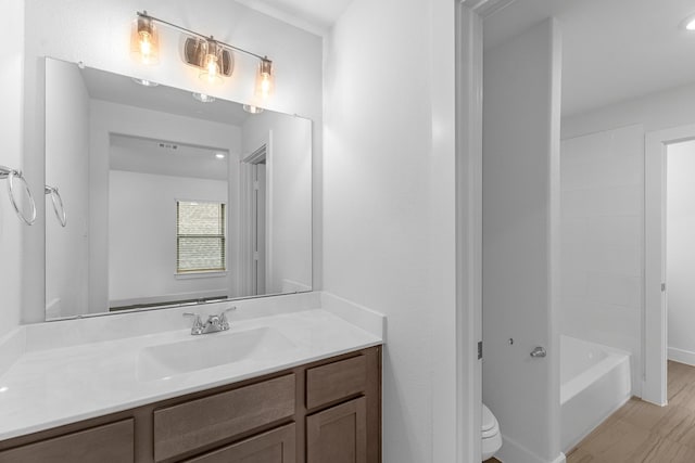 full bathroom featuring toilet and vanity