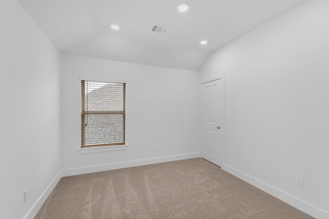 spare room featuring recessed lighting, baseboards, visible vents, and light carpet