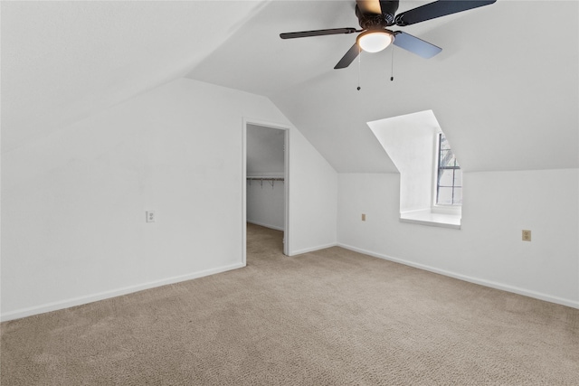 bonus room featuring vaulted ceiling, carpet flooring, baseboards, and ceiling fan