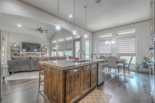 kitchen with a sink, a kitchen breakfast bar, dark wood-type flooring, and dishwasher