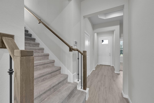 2512 Seneca Lake Dr, Texas City, TX 77568 - foyer entrance with stairs, light wood finished floors, and baseboards