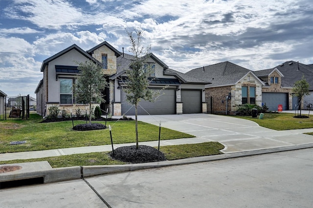 view of front of property featuring stone siding, driveway, a front lawn, and a standing seam roof