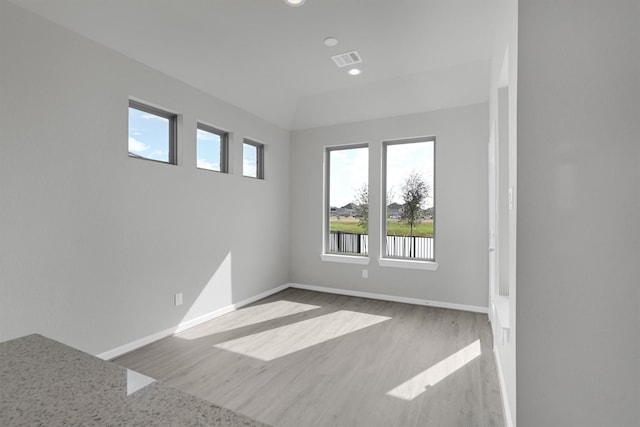 2512 Seneca Lake Dr, Texas City, TX 77568 - spare room featuring healthy amount of natural light, baseboards, wood finished floors, and recessed lighting