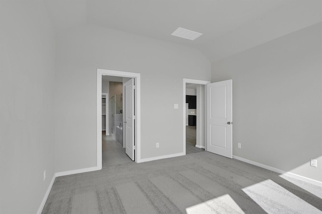 2512 Seneca Lake Dr, Texas City, TX 77568 - unfurnished bedroom featuring vaulted ceiling, carpet, and baseboards
