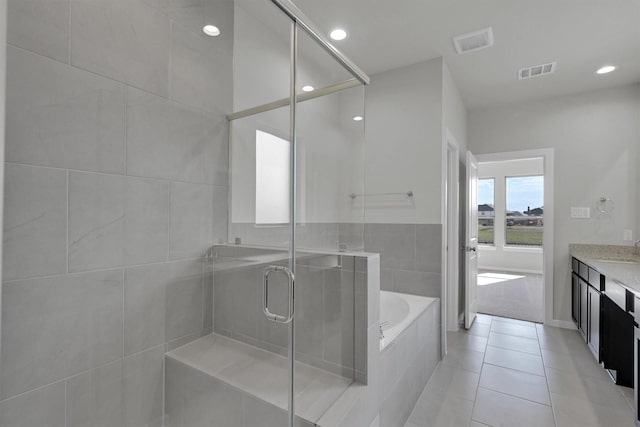 2512 Seneca Lake Dr, Texas City, TX 77568 - full bath with a shower stall, a garden tub, vanity, tile patterned flooring, and recessed lighting