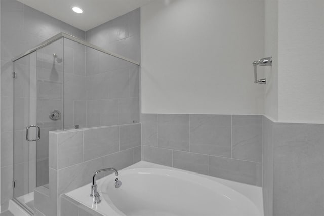 2512 Seneca Lake Dr, Texas City, TX 77568 - bathroom with a bath and a shower stall