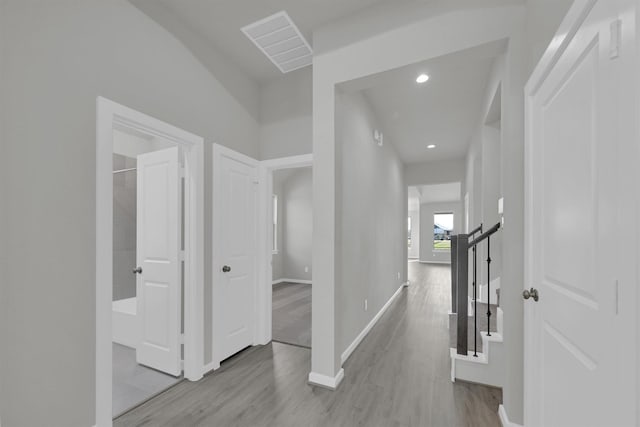 2512 Seneca Lake Dr, Texas City, TX 77568 - hallway with wood finished floors, baseboards, and recessed lighting
