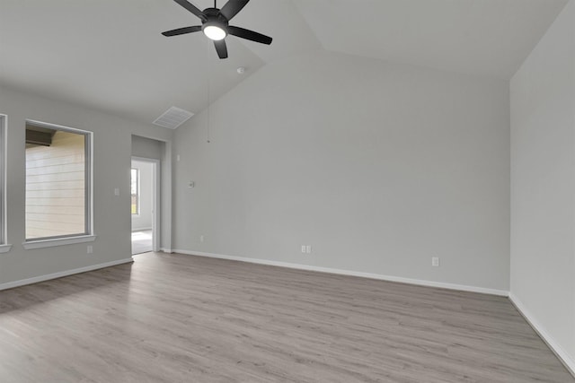 2512 Seneca Lake Dr, Texas City, TX 77568 - unfurnished room with a ceiling fan, vaulted ceiling, light wood finished floors, and baseboards