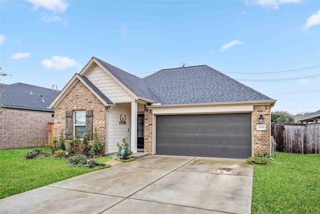 ranch-style home with concrete driveway, a garage, brick siding, and a front lawn