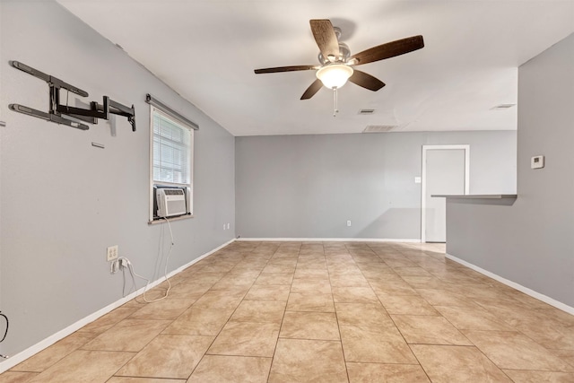 empty room with visible vents, ceiling fan, baseboards, light tile patterned floors, and cooling unit