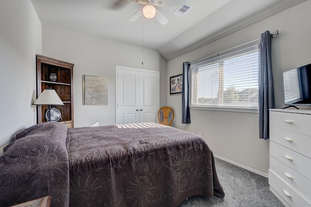 carpeted bedroom featuring vaulted ceiling, a ceiling fan, visible vents, and a closet