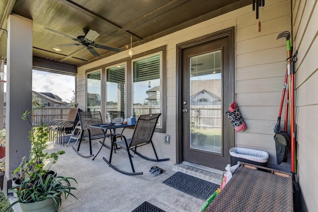 view of patio / terrace featuring fence and ceiling fan