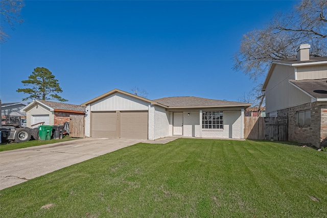 ranch-style house with fence, an attached garage, concrete driveway, a front lawn, and brick siding