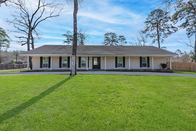 ranch-style home with brick siding, a porch, a front yard, and fence