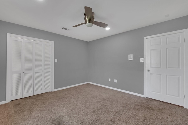 unfurnished bedroom featuring visible vents, baseboards, and carpet floors