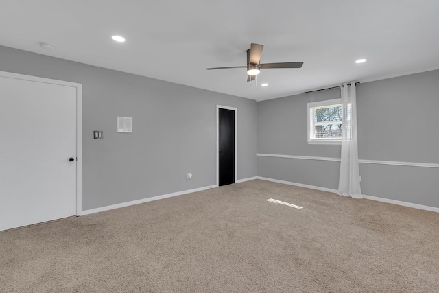 spare room with recessed lighting, baseboards, and carpet flooring