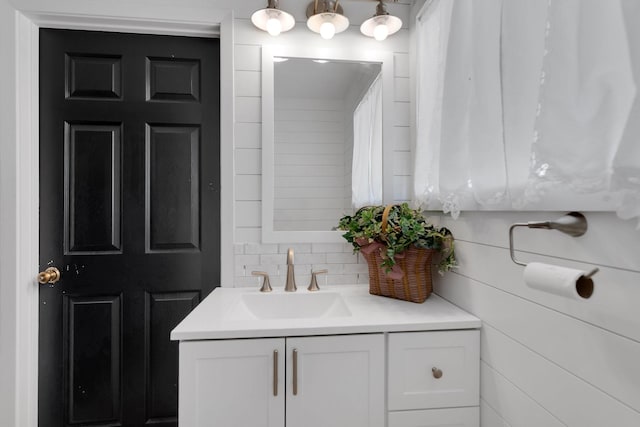 bathroom featuring tasteful backsplash and vanity