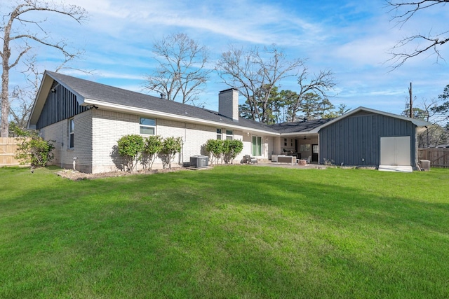 back of house with a lawn, central AC unit, outdoor lounge area, and fence