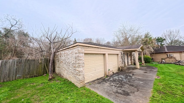 detached garage featuring fence