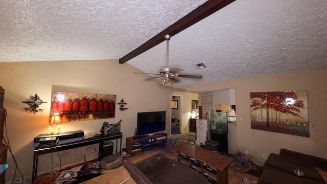 living area featuring visible vents, a ceiling fan, a textured ceiling, wood finished floors, and vaulted ceiling with beams