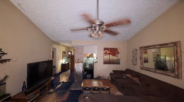 living room with a textured ceiling, lofted ceiling, and ceiling fan