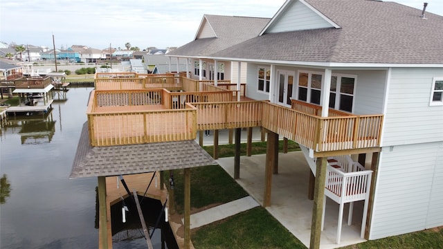 view of jungle gym with a patio area, a water view, and a residential view