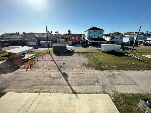 view of yard featuring a residential view