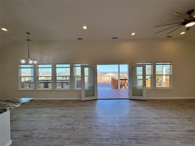 unfurnished room with recessed lighting, baseboards, and wood finished floors