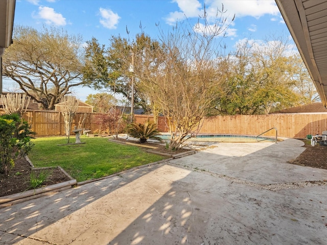 view of yard with a patio area, a fenced in pool, and a fenced backyard