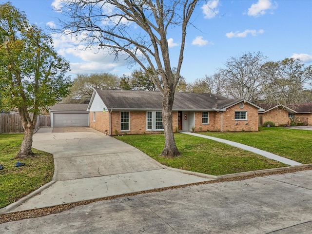 ranch-style house with brick siding, a front lawn, and fence