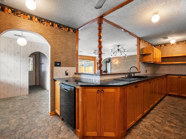 kitchen featuring tasteful backsplash, dark countertops, dishwasher, arched walkways, and open shelves